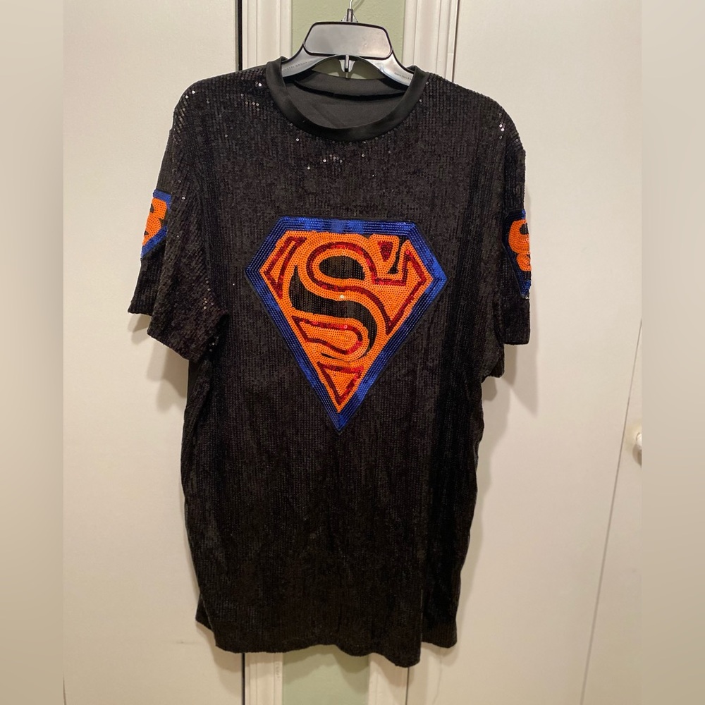 Worn 1x blk front sequined dress w logo on front & sides of both sleeves Sz L